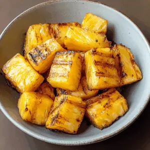 Sweet, juicy grilled pineapple made effortlessly in your air fryer! This delicious side or dessert is perfect for BBQs or a light treat, caramelizing the natural sugars for extra flavor. Easy to whip up and sure to impress your guests. Save this recipe to enjoy the tropical taste any time you want! 🍍✨