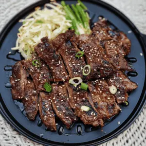 These Grilled Korean Short Ribs are a mouthwatering treat that infuses sweet and savory flavors with a perfect char. The tender meat is marinated in a delicious blend of soy sauce, garlic, and brown sugar for a tasty grilling experience. Ideal for summer barbecues or a cozy family dinner. Save this recipe to impress your guests at your next gathering!