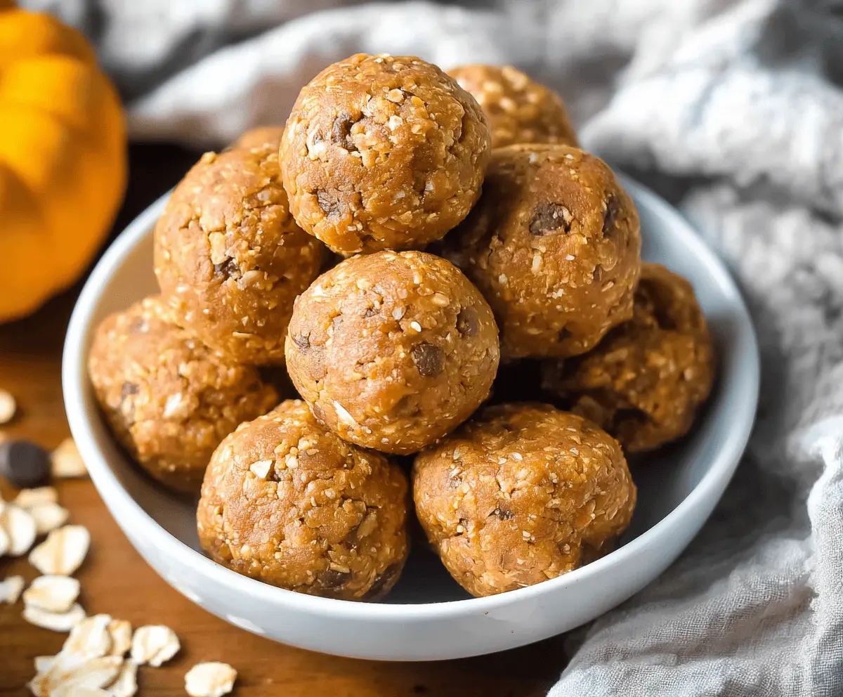 Healthy pumpkin spice protein balls arranged on a white plate with a cozy autumn background, perfect for a nutritious snack