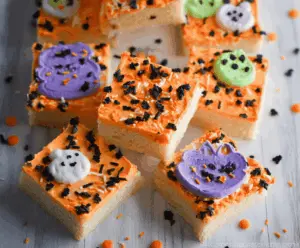 Decorative Halloween Sugar Cookie Bars with colorful frosting and spooky sprinkles for a festive treat